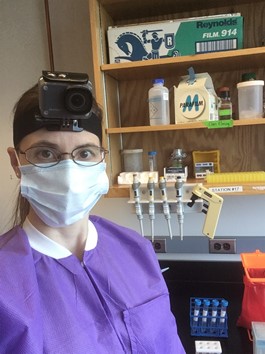 Dr. Stefanie Chen wearing PPE and a head-mounted camera.