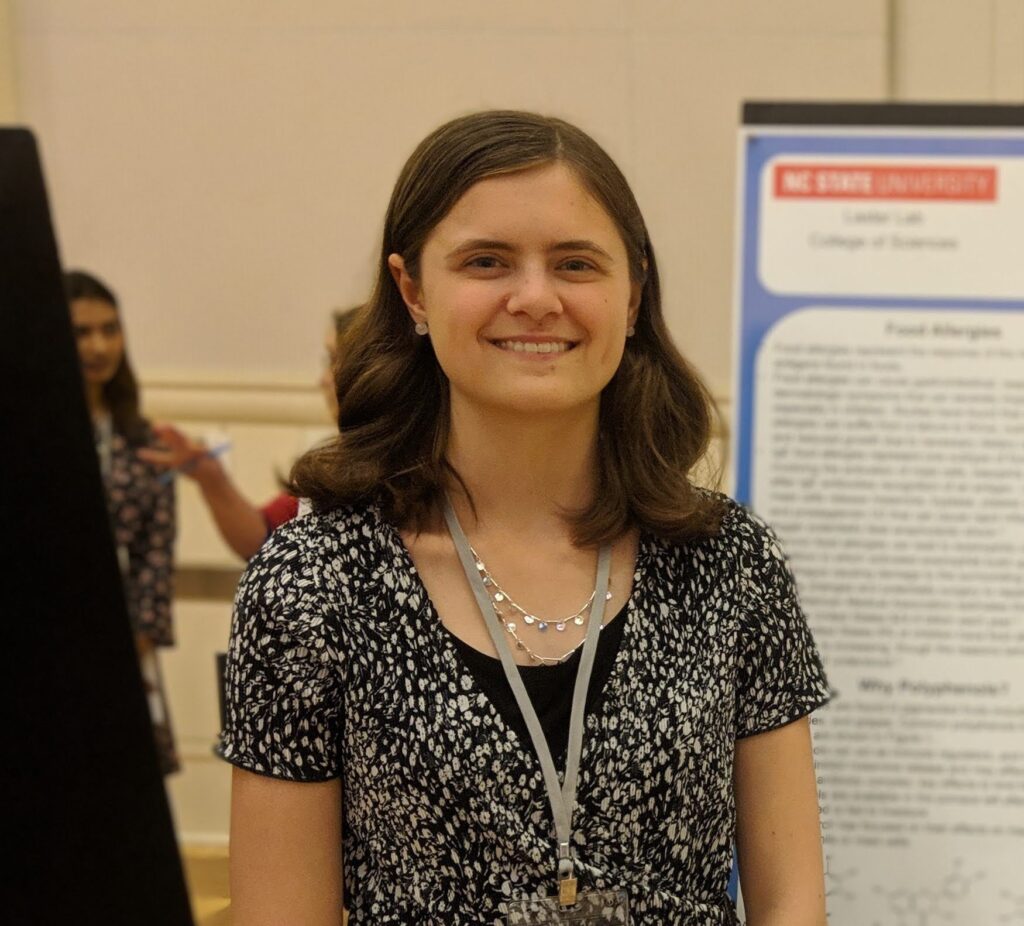 Rose Krebs presenting a research poster.